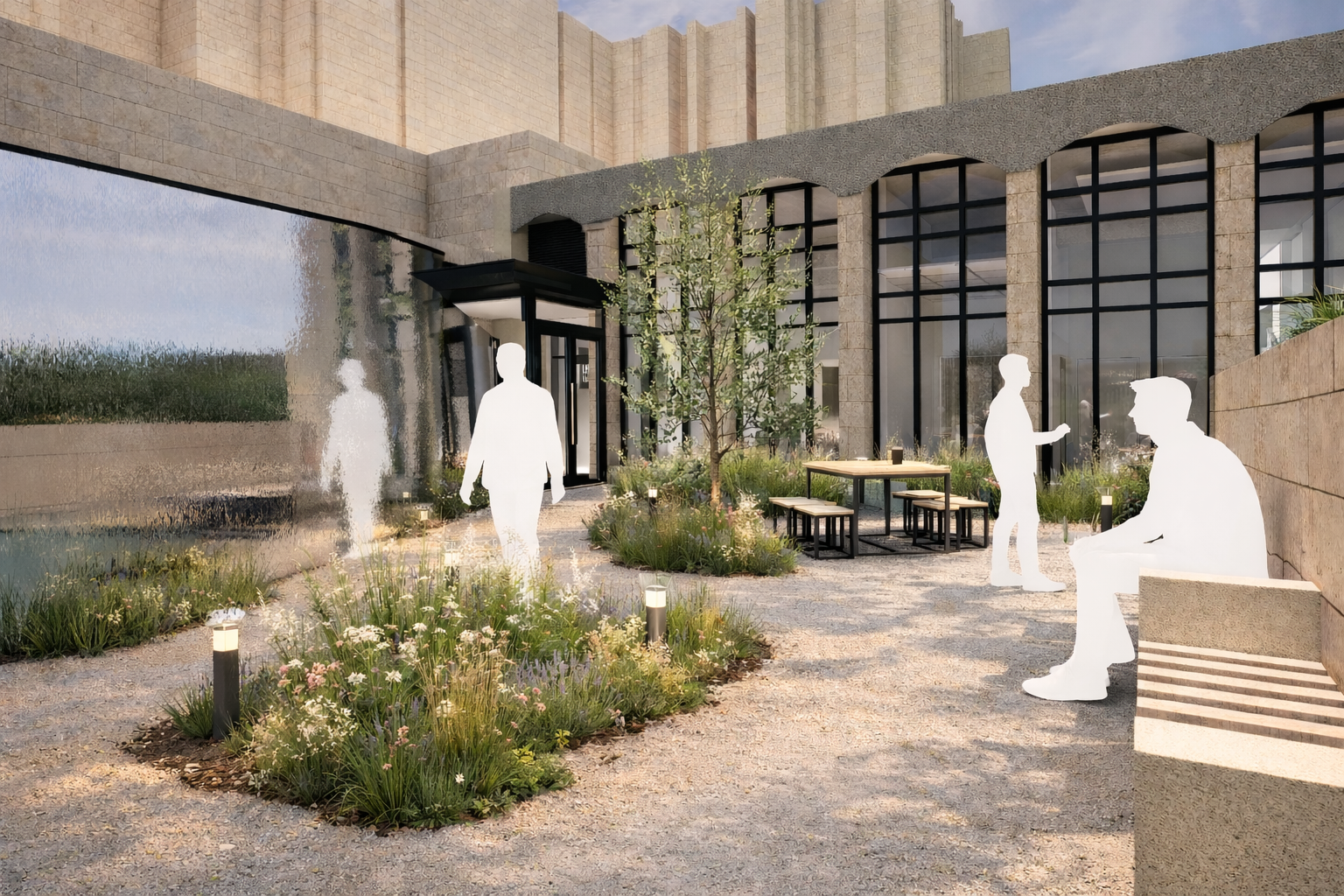 Race Cottam Associates Ltd — Courtyard view of the entrance into the building with a concrete and black metal framed glass facade, featuring outdoor seating, planted borders, a ri