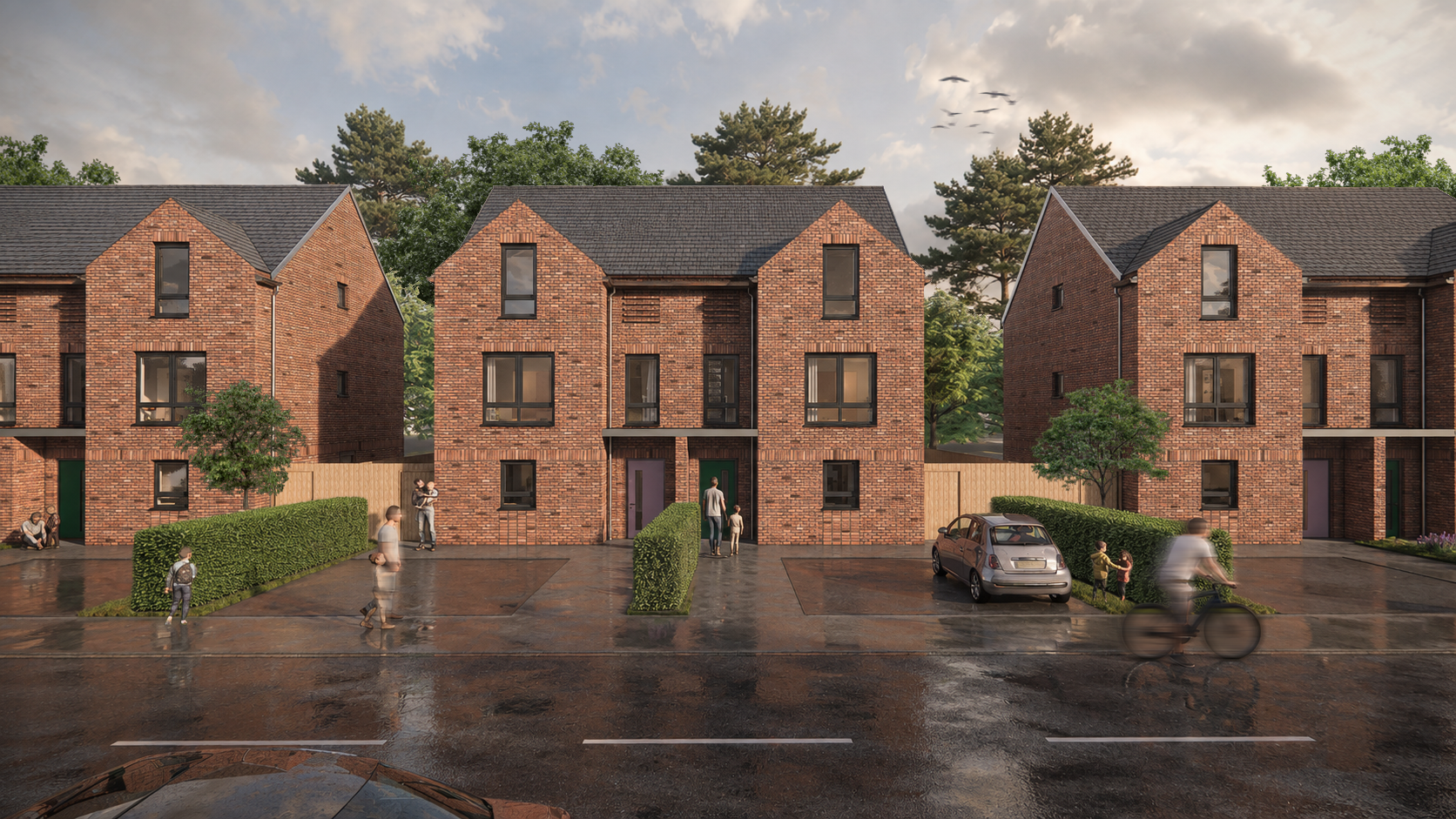 Race Cottam Associates Ltd — Row of red-brick townhouses beside a wet road after rain, with trees, a parked car and a cyclist in front.